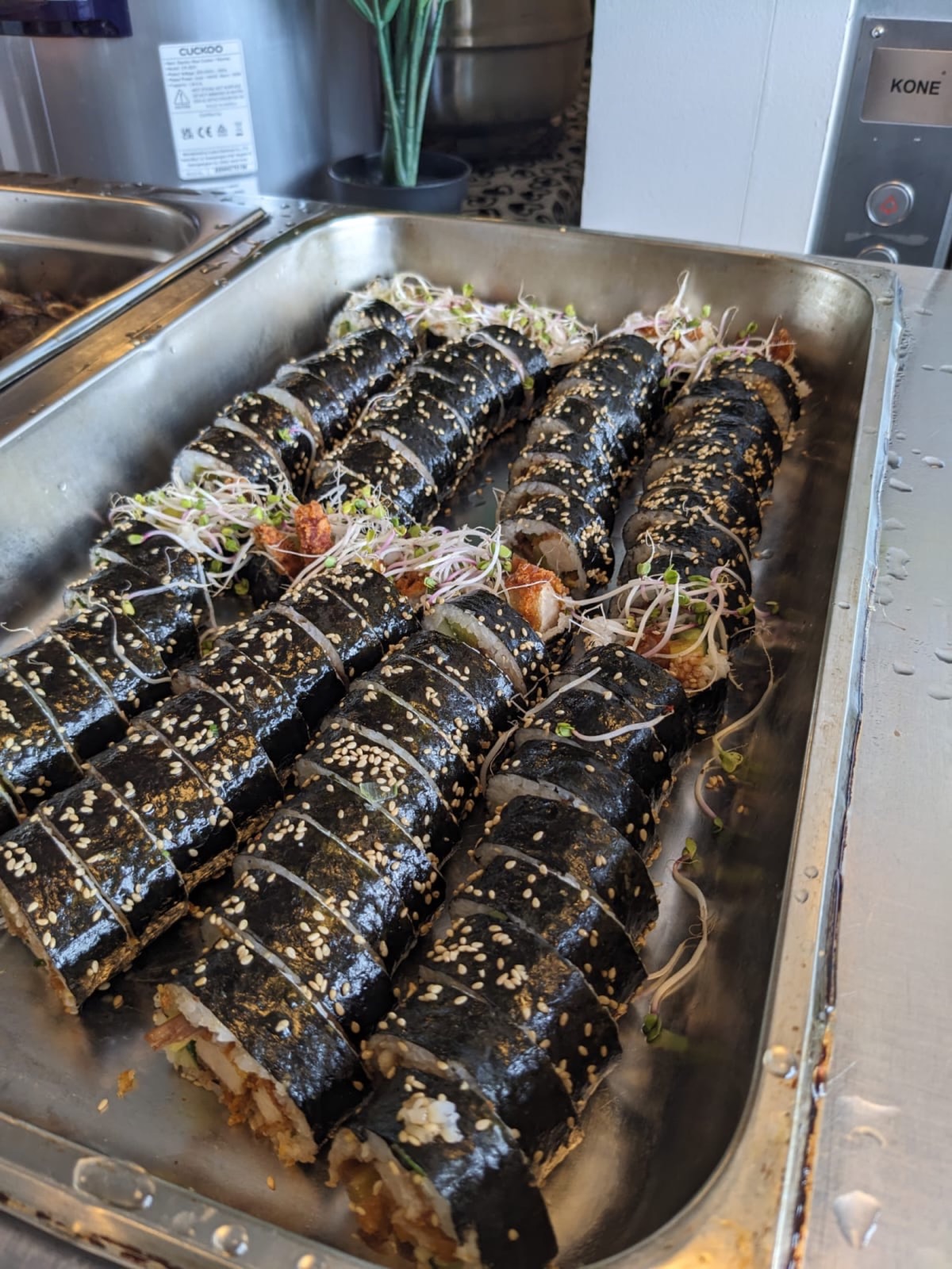 Trays of sliced kimbap prepared for touring personnel